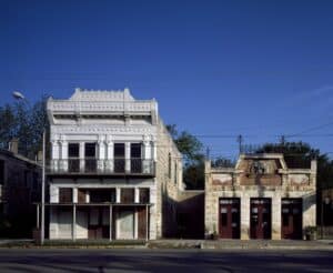 Historic limestone and white-painted buildings on Main Street in Fredericksburg, Texas