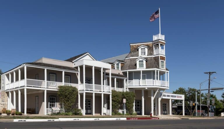 The white timber Admiral Nimitz Museum building, the former Nimitz Hotel, on East Main Street in Fredericksburg, Texas